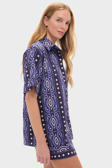 Woman in profile wearing Navy and Ecru Salty Promises Shirt, a classic, effortless poplin set, showcasing fun, high-end geometric print, perfect for casual or getaway looks.