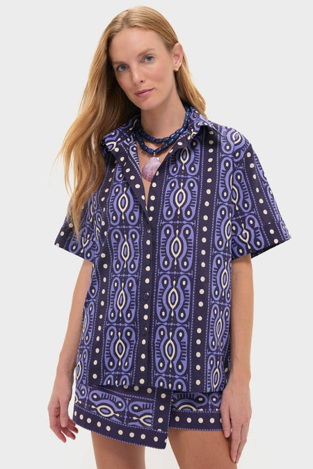 Model in Navy and Ecru Salty Promises Shirt, a classic, effortless poplin top with geometric print, accessorized with beaded necklaces, embodying fun, high-end style.