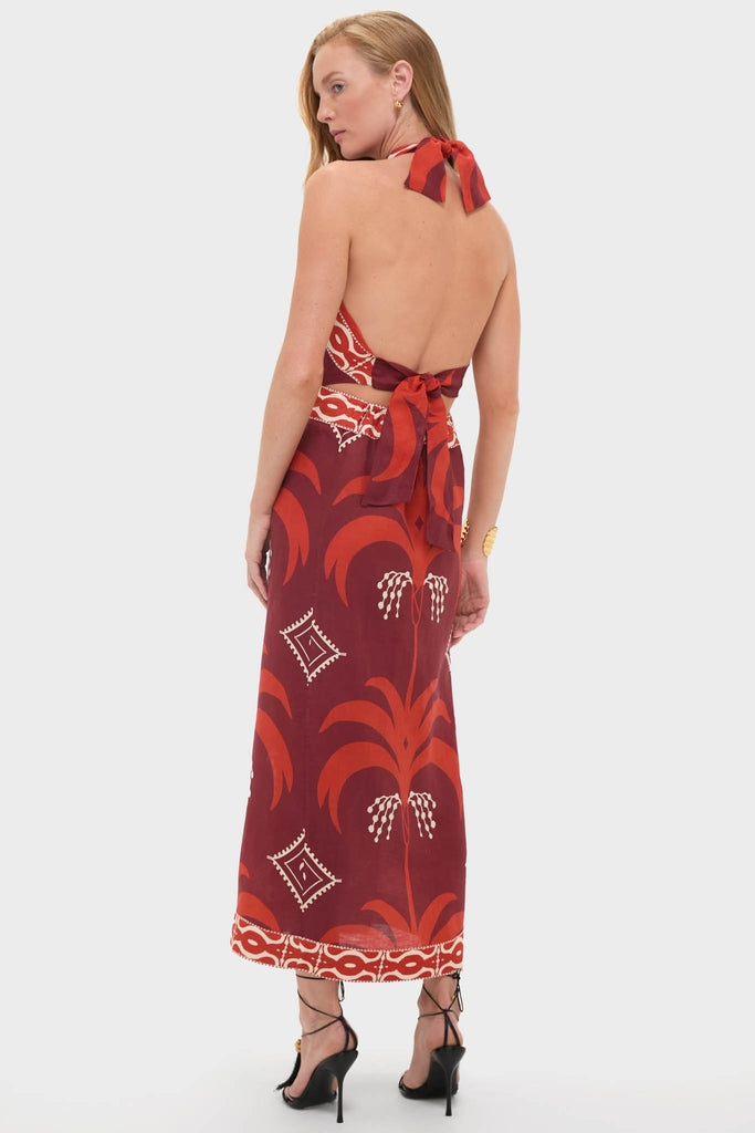 Model in classic Wine and Red Buen Viento Ankle Dress with bold graphic print, showcasing an effortless, high-end resort style with black strappy sandals and simple jewelry.