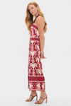 Woman in profile wearing the Dark Cherry and Ecru Ancient Peru Ankle Dress, showcasing a classic, effortless design with a botanical print, paired with high-end brown strappy sandals.
