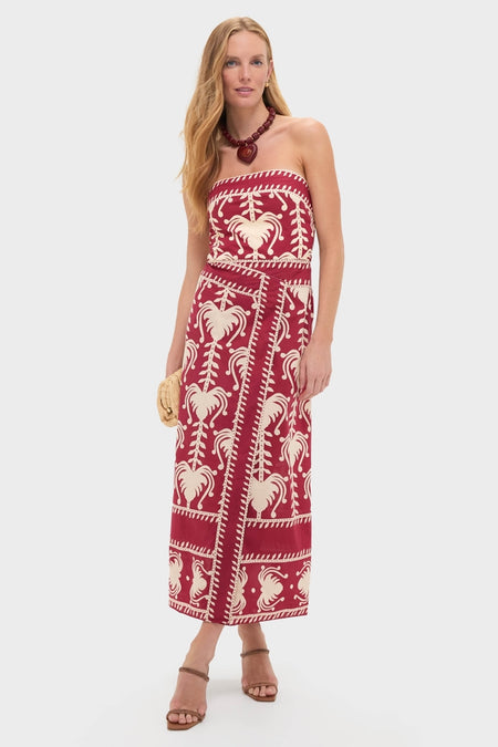 Woman models the Dark Cherry and Ecru Ancient Peru Ankle Dress with a classic botanical motif, accessorized with a chunky necklace, straw clutch, and strappy sandals, embodying effortless, high-end style.