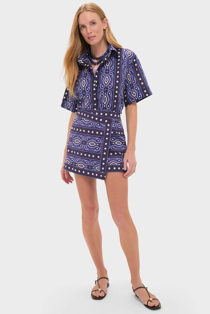 Model in a classic, effortless Navy and Ecru Hunting Roots Wrap Skirt and matching shirt, exuding fun and high-end style.