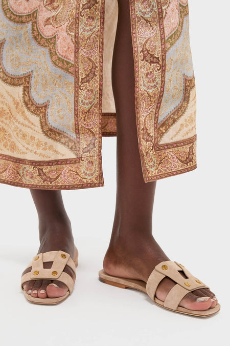 Classic and effortless, the Sand Via Slides feature light beige suede in an H strap design with gold stud accents, perfect for a fun, high-end look.