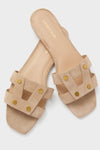 Sand Via Slides: Classic, high-end women’s slip-on sandals featuring light beige suede, effortless crossover straps with gold-tone studs, and a square-toed footbed. Perfect for fun, confident styling.