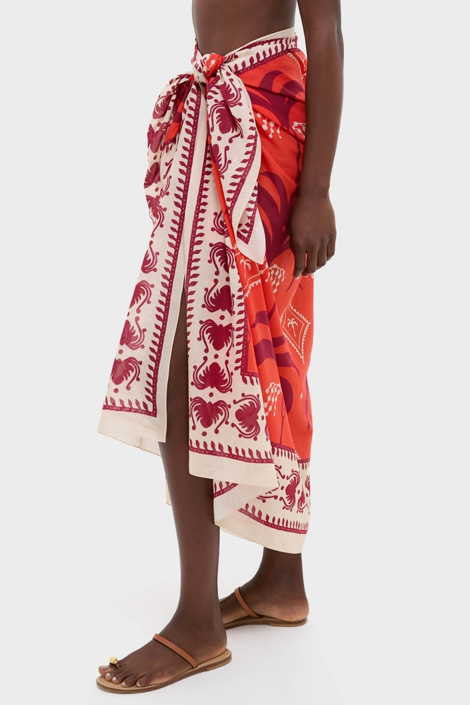 Classic and effortless Red, Ecru, and Dark Cherry Dance of Pareo, knotted at the waist, with a fun, high-end vibe, perfect for barefoot adventures.