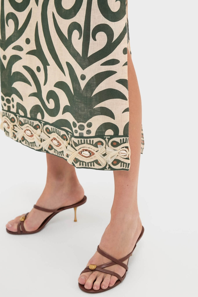 Ecru and Green Water Adventure Midi Dress with tribal print, showcasing an effortless, classic style; features a beaded hem, thigh-high slit, paired with high-end strappy sandals.