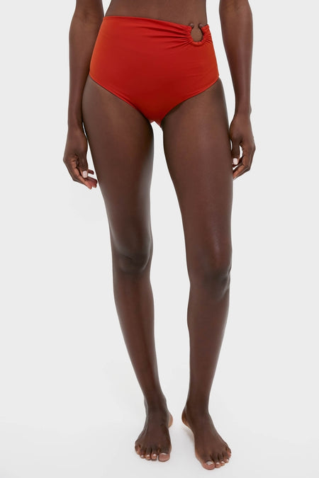 Model wears Fire Red Taita Bikini Bottom with high-rise fit, ruching, and bead detail, embodying a classic, effortless, and high-end style.