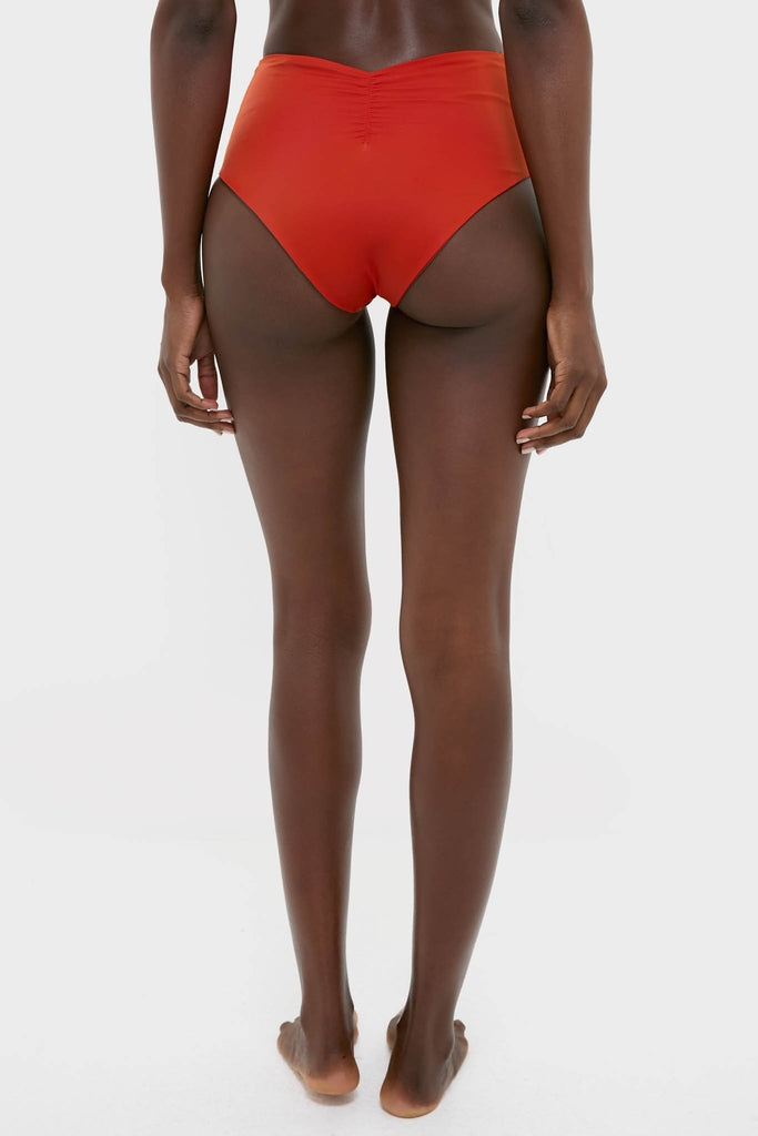 Back view of the Fire Red Taita Bikini Bottom, showcasing a classic high-rise fit with ruching and a bead accent, embodying an effortless, high-end style.