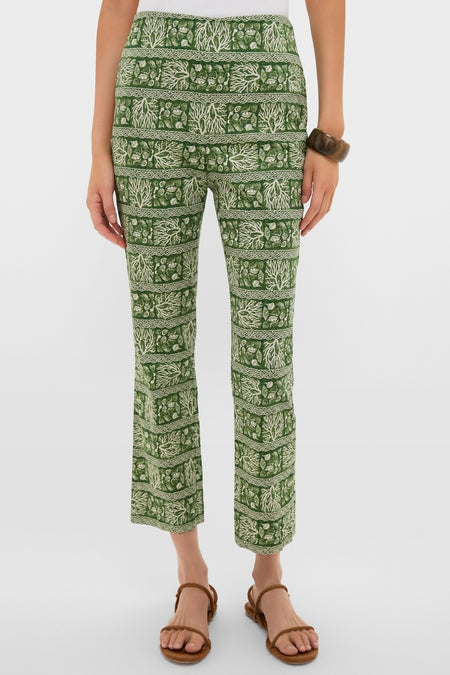 Woman wearing classic Cowrie Block Print Ashford Pants with forest-green botanical pattern, paired with brown sandals and bangle for an effortless, high-end Tuckernuck style.