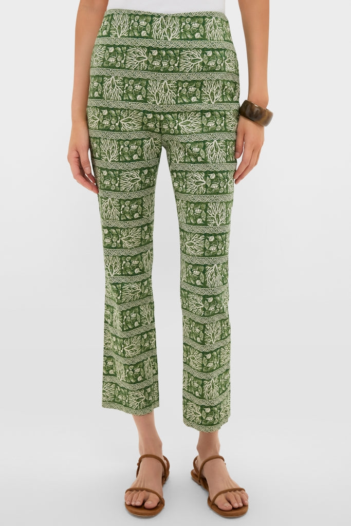 Woman wearing classic Cowrie Block Print Ashford Pants with forest-green botanical pattern, paired with brown sandals and bangle for an effortless, high-end Tuckernuck style.