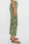 Classic Cowrie Block Print Ashford Pants in a green botanical pattern, paired with brown sandals, offering an effortless and fun high-end style. Perfect for any occasion.