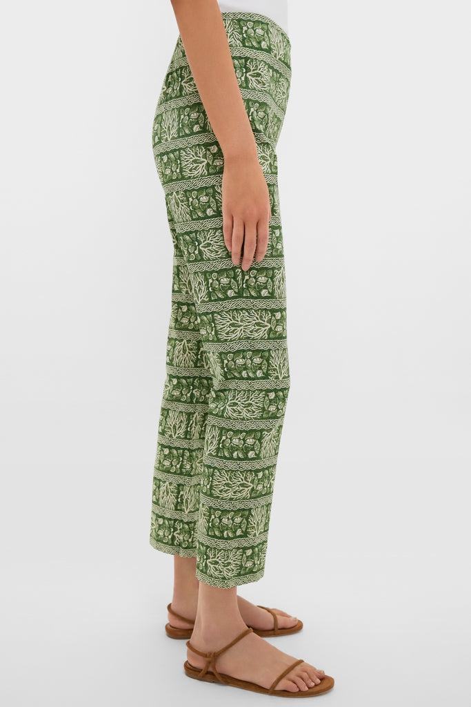 Classic Cowrie Block Print Ashford Pants in a green botanical pattern, paired with brown sandals, offering an effortless and fun high-end style. Perfect for any occasion.
