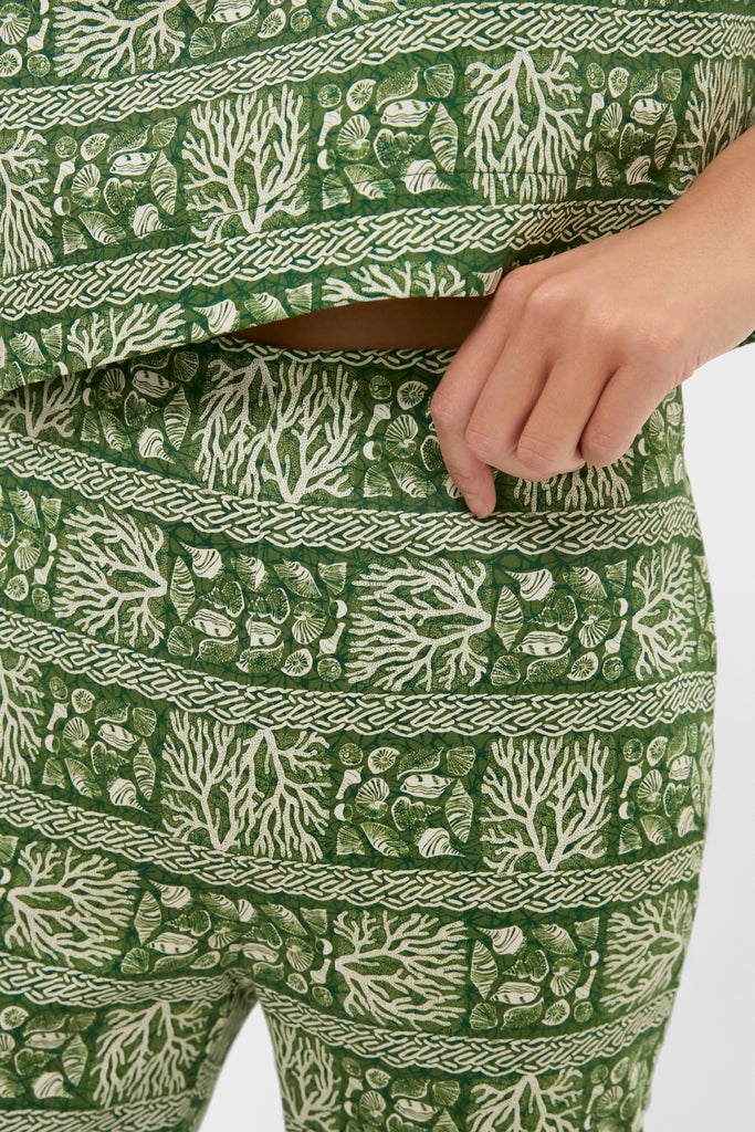 Effortlessly cool Cowrie Block Print Ashford Pants featuring a classic marine motif in white, showcasing braided-cord pattern bands. A fun, high-end addition to any wardrobe.