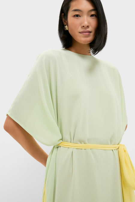 Woman wearing the classic Mint Chiffon Caftan Gown with dolman sleeves and yellow sash, embodying an effortless, high-end style perfect for fun evening events.