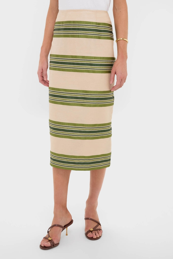 Classic and effortless, the Satin Stripe Ellington Skirt features wide olive-green stripes, offering a high-end, fun style with brown strappy sandals and a gold bangle.