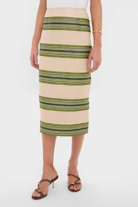 Classic and effortless, the Satin Stripe Ellington Skirt features wide olive-green stripes, offering a high-end, fun style with brown strappy sandals and a gold bangle.
