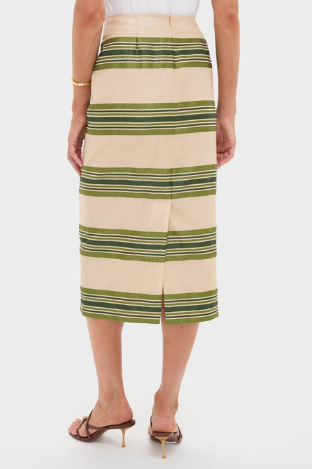 Satin Stripe Ellington Skirt in light beige with olive stripes, classic pencil style, features a back vent. Paired with brown heels and white top, exuding effortless, high-end elegance.