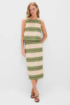 Woman in a classic, effortless Satin Stripe Ellington Skirt ensemble with olive and cream stripes, exuding fun and high-end style, paired with brown strappy sandals.