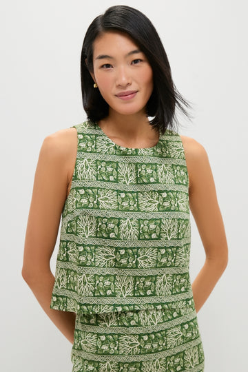 Woman wearing the Cowrie Block Print Keating Top, showcasing a classic, sleeveless, boxy-cut design with effortless botanical motifs, embodying a fun and high-end style.