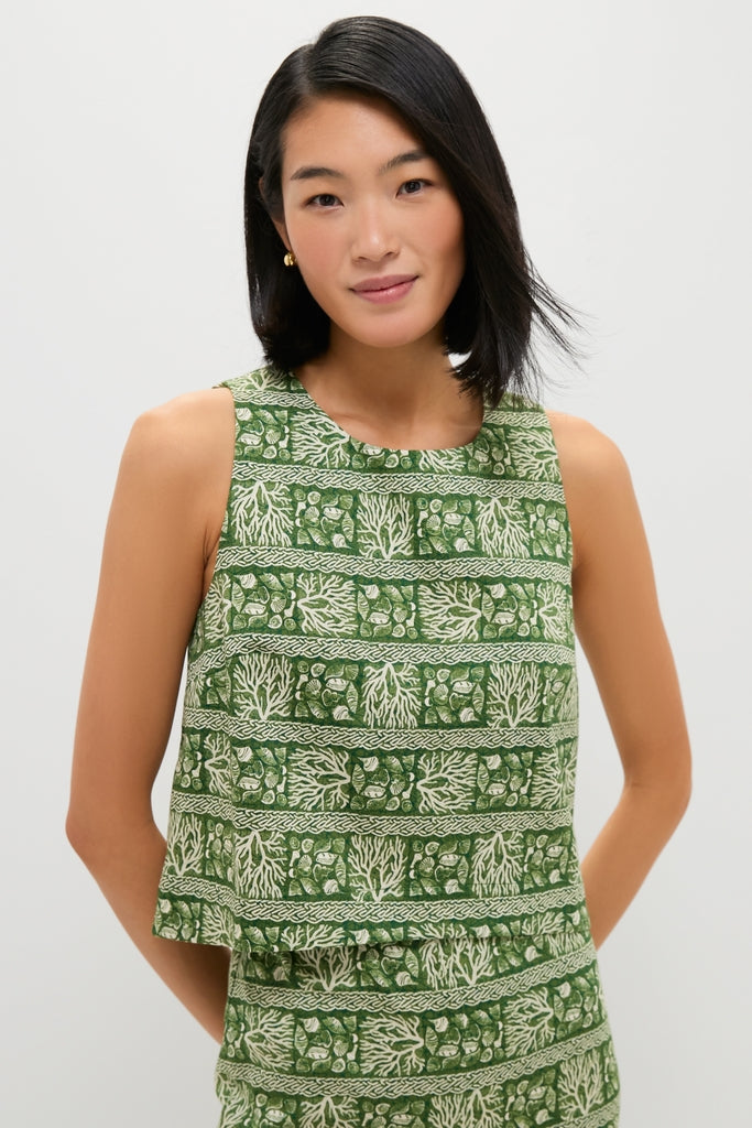 Woman wearing the Cowrie Block Print Keating Top, showcasing a classic, sleeveless, boxy-cut design with effortless botanical motifs, embodying a fun and high-end style.