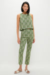 Young woman models the Cowrie Block Print Keating Top, a classic, effortless sleeveless crop top with slim-fit trousers in a fun, high-end botanical print.