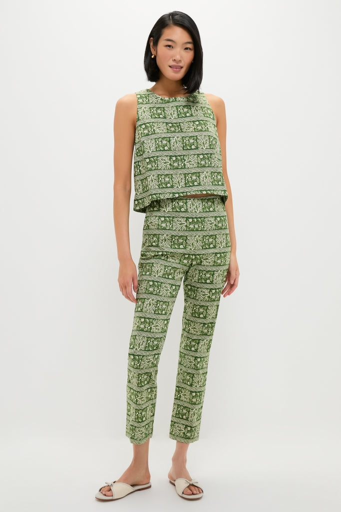 Young woman models the Cowrie Block Print Keating Top, a classic, effortless sleeveless crop top with slim-fit trousers in a fun, high-end botanical print.