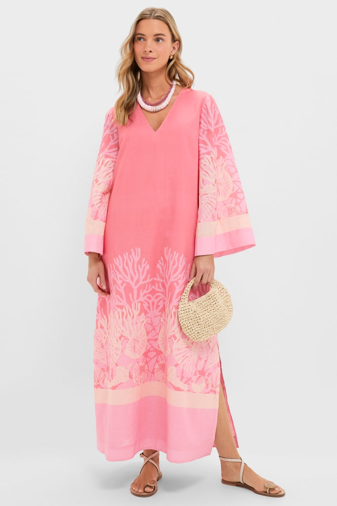 Hopewell Coral Printed V-Neck Lorena Caftan, a classic, effortless kaftan with botanical print, side slit, and bell sleeves, styled with fun accessories for a high-end look.