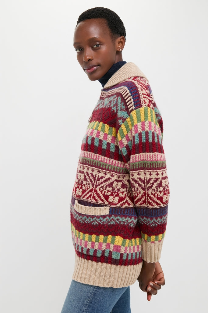 Person modeling Brick Multi Cotton Wool Blend Sweater, featuring a classic, chunky Fair Isle pattern with a ribbed shawl collar, paired with slim jeans for an effortless, high-end look.