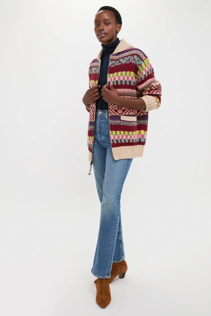 Person wearing a classic Brick Multi Cotton Wool Blend Sweater by Polo Ralph Lauren, styled effortlessly with blue jeans and brown ankle boots, exuding a high-end, fun vibe.