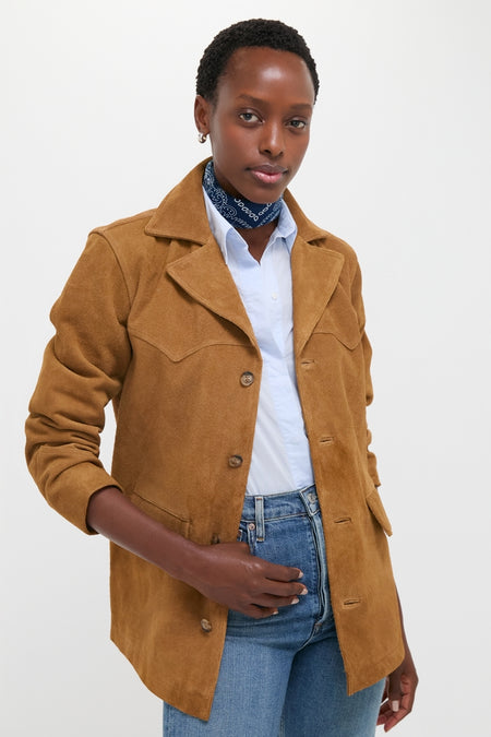A person models the Maple Cow Roughout Suede Jacket, a classic, effortless piece with western flair, featuring notch lapels and distinctive seams, embodying high-end, fun style.