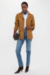 Woman exudes effortless style in the Maple Cow Roughout Suede Jacket, classic tailored blazer blending high-end Western flair with fun, relaxed confidence.