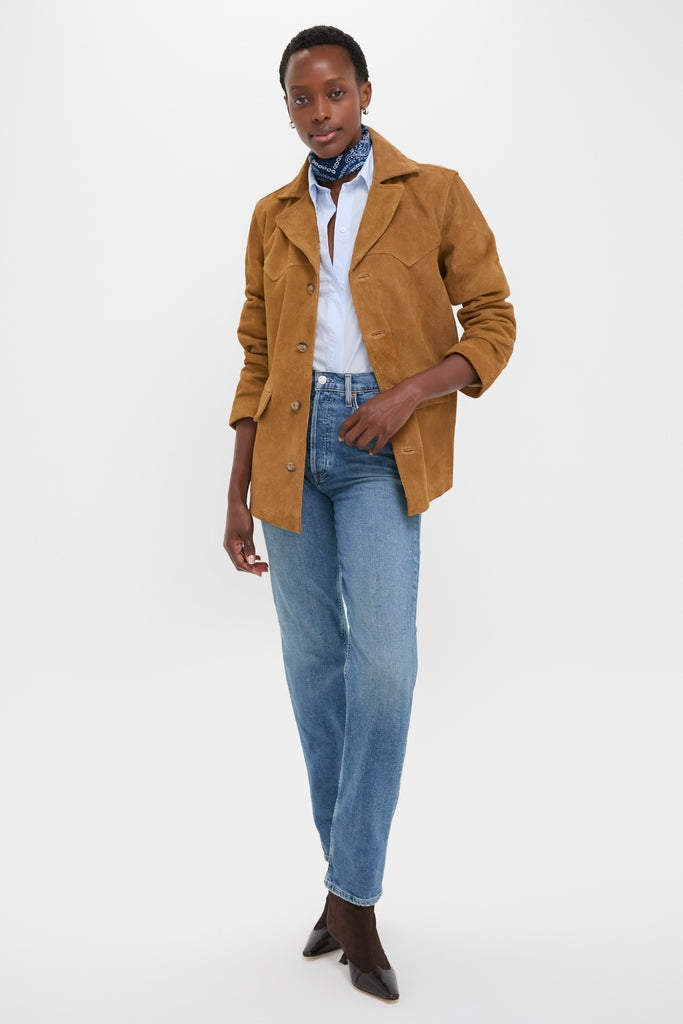 Person wearing the Maple Cow Roughout Suede Jacket, epitomizing classic Western elegance with effortless style; paired with jeans, boots, and a neckerchief for a high-end, fun look.