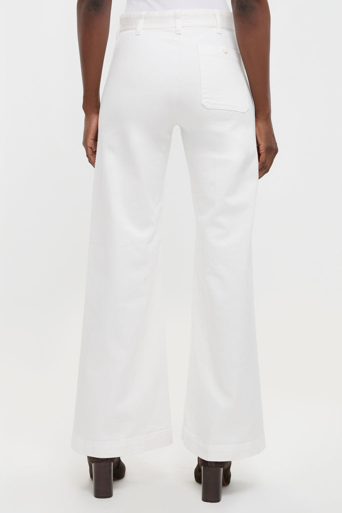 Classic Nevis Cotton Twill Woven Standard Flare Pants showcasing a high-rise, wide-leg design with a single back pocket, paired effortlessly with high-end ankle boots for a fun, confident look.