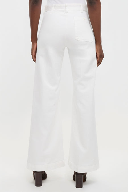 Classic Nevis Cotton Twill Woven Standard Flare Pants showcasing a high-rise, wide-leg design with a single back pocket, paired effortlessly with high-end ankle boots for a fun, confident look.