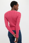 Person wearing a classic Nantucket Red Cardigan with cable-knit detail and ribbed trim, embodying an effortless, high-end style.