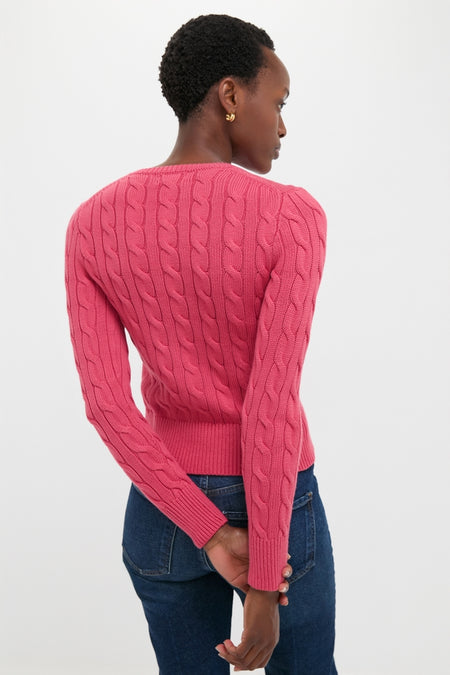 Person wearing a classic Nantucket Red Cardigan with cable-knit detail and ribbed trim, embodying an effortless, high-end style.