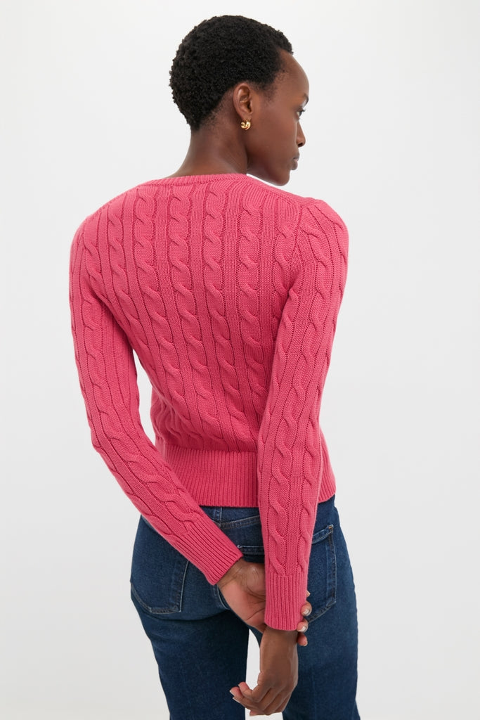 Person wearing a classic Nantucket Red Cardigan with cable-knit detail and ribbed trim, embodying an effortless, high-end style.