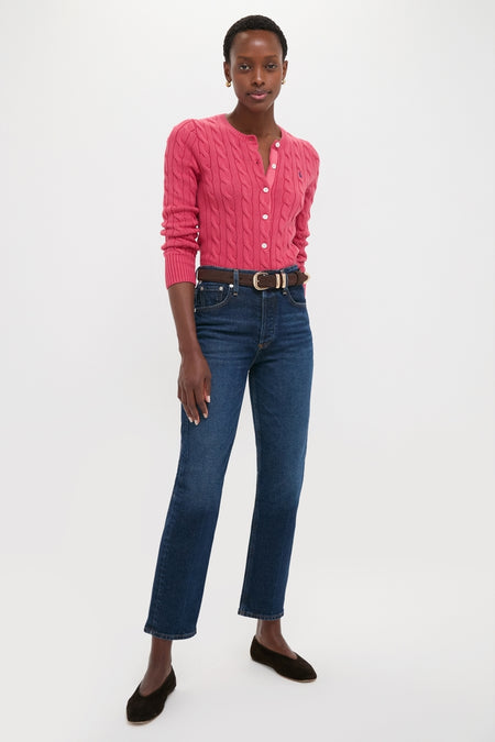 Classic Nantucket Red Cardigan on a woman, effortlessly styled with jeans and flats, showcasing cable-knit detail and ribbed trim for a high-end, fun look.