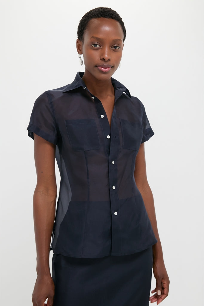 Atlantic Silk Organza Woven Short Sleeve Button Down, featuring a classic, tailored silhouette with sheer silk fabric, shell buttons, and waist darts for an effortless, high-end look.