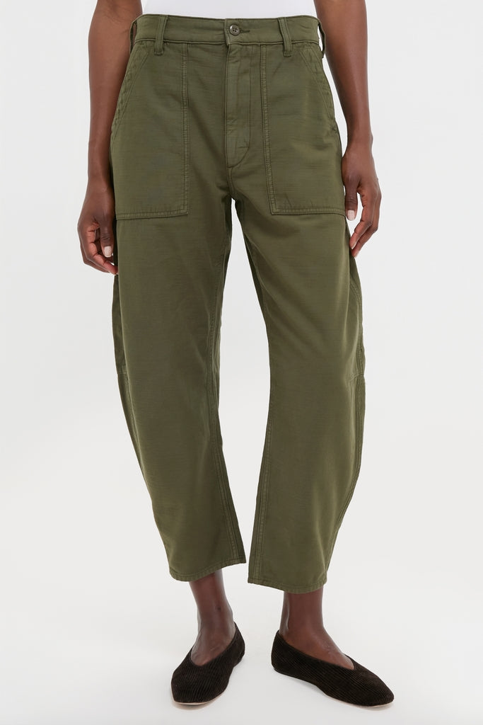 Dark Olive Reverse Sateen Woven Ankle Tapered Pants with high waistband, patch pockets, and tapered legs, offering a classic, effortless, high-end utility style.