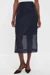 Atlantic Silk Organza Woven Midi Pencil Skirt with sheer hem, vented design, and waist darts, paired with slingback heels. Classic, effortless style for high-end fashion enthusiasts.