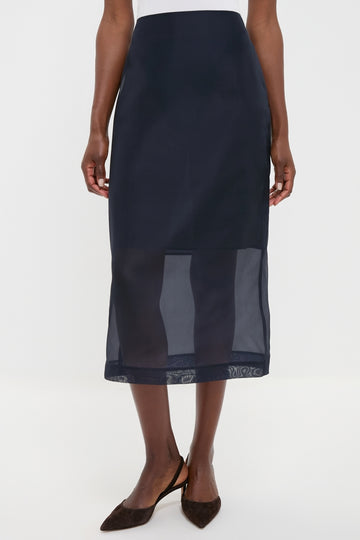 Atlantic Silk Organza Woven Midi Pencil Skirt with sheer hem, vented design, and waist darts, paired with slingback heels. Classic, effortless style for high-end fashion enthusiasts.