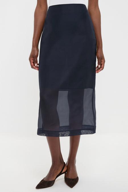 Atlantic Silk Organza Woven Midi Pencil Skirt with sheer hem, vented design, and waist darts, paired with slingback heels. Classic, effortless style for high-end fashion enthusiasts.