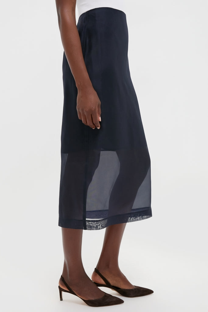 Atlantic Silk Organza Woven Midi Pencil Skirt with sheer panel and vented hem, paired effortlessly with pointed-toe slingback heels for a classic, high-end look.