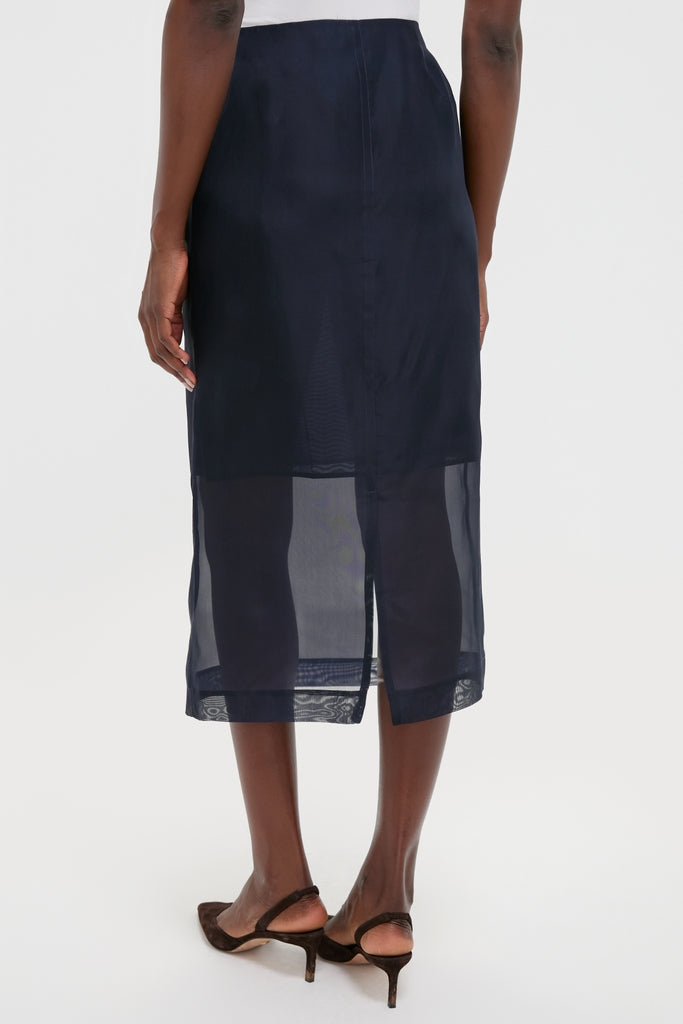 Atlantic Silk Organza Woven Midi Pencil Skirt, featuring an effortless classic silhouette with sheer organza panels, paired with chic dark brown slingback shoes.