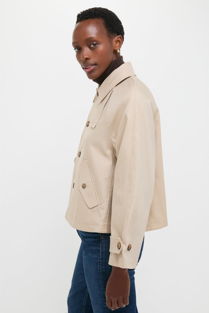 Beige Cotton Double Cloth Woven Jacket paired with a dark turtleneck and jeans, featuring classic tortoiseshell buttons and flap pockets for an effortless, high-end look.