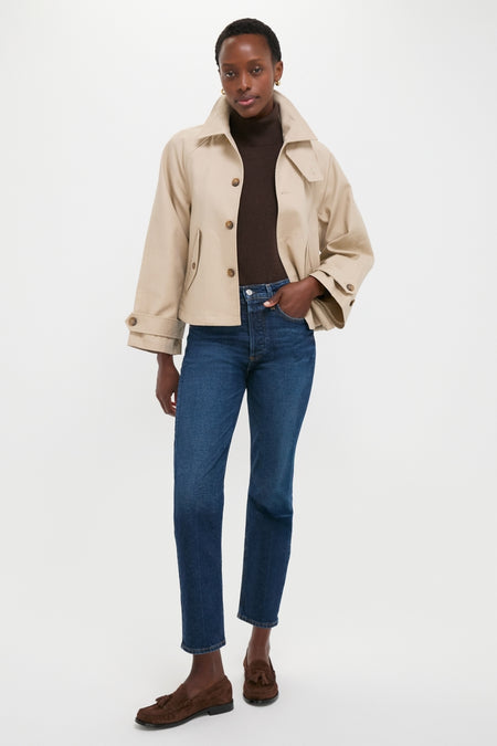 Model wearing Polo Ralph Lauren's Beige Cotton Double Cloth Woven Jacket, a classic, high-end piece paired with denim and loafers for an effortless, fun, and confident look.