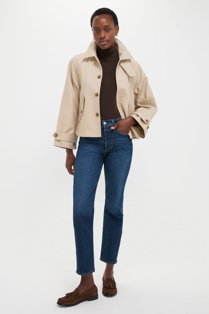 Model wearing Polo Ralph Lauren's Beige Cotton Double Cloth Woven Jacket, a classic, high-end piece paired with denim and loafers for an effortless, fun, and confident look.