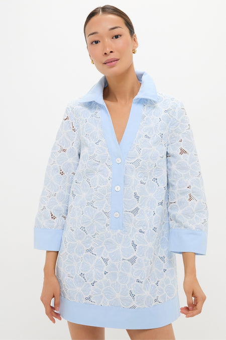Woman models classic Blue Floral Lace Collier Dress with light blue accents and floral lace, offering an effortless, fun, and high-end look, perfect for any occasion.