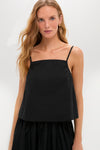 Woman wears the Black Cotton Poplin Mandi Top, a classic, effortless camisole with spaghetti straps, perfect for a high-end, fun look.
